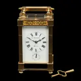 Reloj de Viaje, FRANCIA, PRINCIPIOS DEL SIGLO XX, Bronce y metal dorado, carátula porcelanizada con la leyenda "LA ESMERALDA MEXICO", números romanos, vidrios biselados, con llave