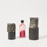 Christo, Wrapped Cans and Bottle, 1958-1959, fabric, lacquer, paint, rope, four cans, glass bottle, plastic cap and red pigment