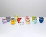 Ai Weiwei, Coloured Vases, 2008, industrial paint on Neolithic vases, in 13 parts