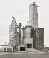Grain Elevator, Sheldon, Illinois, USA by Bernd and Hilla Becher, 1986, gelatin silver print, mounted, offered Jun 2025