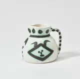 Têtes (Heads) (A.R. 368) by Pablo Picasso, 1956, White earthenware turned pitcher painted in black with partial brushed glaze, sold Jun 2025