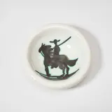 Picador (Bullfighter) (A.R. 176) by Pablo Picasso, 1952, White earthenware round ashtray painted in black with partial brushed glaze, sold Jun 2025