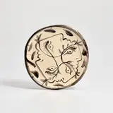 Quatre profils enlacés (Four Enlaced profiles) (see A.R. 86) by Pablo Picasso, 1949, White earthenware round plate painted in colours and glazed, sold Sep 2025