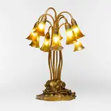Tiffany Studios, Ten-light Lily table lamp base, c. 1910, acid-etched and gilt bronze, hand-blown Favrile glass, hand-blown glass