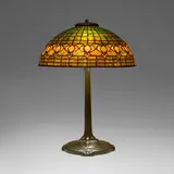 Dichroic Pomegranate table lamp by Tiffany Studios, c. 1910, leaded glass, patinated bronze, sold Mar 2026