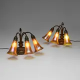 Three-light Lily piano lamp bases, pair by Tiffany Studios, c. 1910, blown glass, patinated bronze, sold Mar 2026