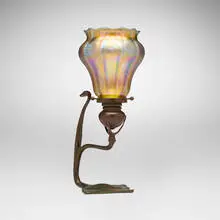 Candlestick by Tiffany Studios, c. 1910, patinated bronze, hand-blown glass, sold Mar 2026