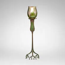 Blown-out root candlestick with pulled-feather shade by Tiffany Studios, c. 1910, patinated bronze, hand-blown Favrile glass, patinated and acid-etched bronze, hand-blown glass, sold Mar 2026