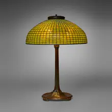 Geometric table lamp by Tiffany Studios, c. 1910, leaded glass, patinated bronze, sold Mar 2026