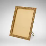 Tiffany Studios, French Ornament picture frame, c. 1920, acid-etched, gilt and enameled bronze, glass
