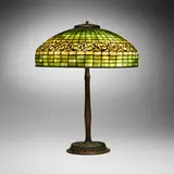 Tiffany Studios, Swirling Leaf adjustable table lamp, c. 1910, leaded glass, acid-etched and patinated bronze