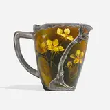 Standard Glaze crucible pitcher with marsh marigolds and Gorham silver overlay by Kate C. Machette for Rookwood Pottery, sold Nov 2024