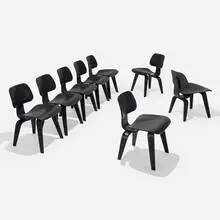 DCWs, set of eight by Charles and Ray Eames, stained ash plywood, rubber, sold Sep 2025