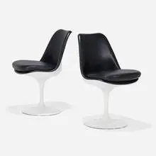 Tulip chairs model 151, pair by Eero Saarinen, lacquered fiberglass, enameled aluminum, leather upholstery, sold Sep 2025