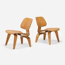 Early LCWs, pair by Charles and Ray Eames, 1945, ash plywood, walnut plywood, sold Sep 2025