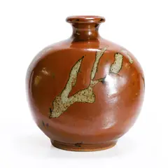Stoneware vase by Shoji Hamada, decorated in an iron glaze with scraped patches, sold Jul 2024