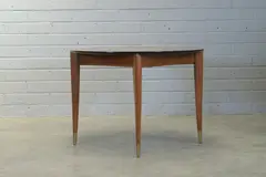 Gio Ponti, Walnut 'Model 2135' extending dining table, raised on tapering brass-capped supports