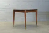 Gio Ponti, Walnut 'Model 2135' extending dining table, raised on tapering brass-capped supports