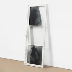 Untitled (Finestra) (S. 20) by Yannis Kounellis, 1985, One glass and two photo-processed glass plates, in a white painted wooden window frame with metal handle and hardware, sold Sep 2025