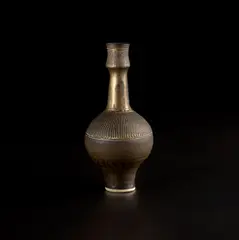 Vase by Lucie Rie, 1988, Porcelain, golden manganese glaze with sgraffito, sold Apr 2025