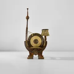 Carlo Bugatti, 'Curule' armchair, circa 1902, Walnut, stained walnut with brass and pewter inlay, parchment, brass, passementerie