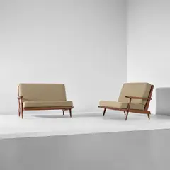 Two single-armed sofas by George Nakashima, 1964, Walnut, fabric, sold Apr 2025