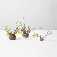 Three flower holders by Gio Ponti, circa 1940, Brass, sold Apr 2025