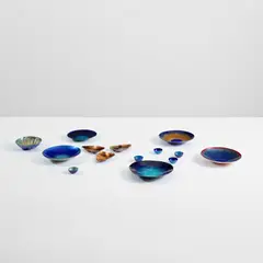 Fourteen vessels by Paolo De Poli, 1940-1960s, Enamelled copper, sold Apr 2025