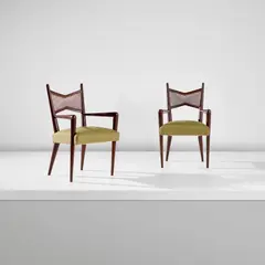Jean Royere, Pair of carver chairs, circa 1955, Stained oak, cane, fabric