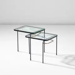 Mathieu Matégot, Two nesting tables, circa 1956, Partially acid-etched glass, painted steel, brass