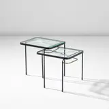 Mathieu Matégot, Two nesting tables, circa 1956, Partially acid-etched glass, painted steel, brass