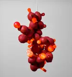Kelley Walker and Wade Guyton, Red Coconut Chandelier, 2006, coconuts, light bulbs, electrical wiring and enamel spray paint