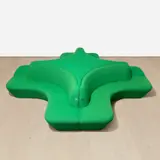 Pharmacy Cross Banquette by Damien Hirst, 1997-98, wooden banquette upholstered with green cloth stuffed with foam, in 2 parts, sold Apr 2024