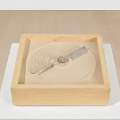 Mona Hatoum, + and –, 1994, hardwood, steel blades, electric motor and sand