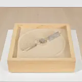 Mona Hatoum, + and –, 1994, hardwood, steel blades, electric motor and sand