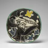 Tête de chèvre en profil (Goat's Head in Profile) (A.R. 151) by Pablo Picasso, 1952, White earthenware round dish painted in colours with partial brushed glaze, sold Jun 2024