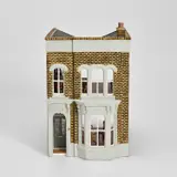 Yinka Shonibare, Untitled (Doll House), 2002, Multiple comprising cast resin doll house, painted in colours, complete with wooden and fabric-covered furniture, miniature framed printed artworks, and accompanying booklet