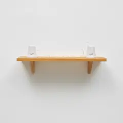 Mona Hatoum, Set in Stone, 2002, Two Carrara marble forms with carved typography ( East and West in Arabic) and string on an oak shelf