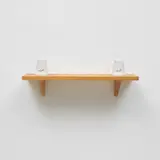 Mona Hatoum, Set in Stone, 2002, Two Carrara marble forms with carved typography ( East and West in Arabic) and string on an oak shelf