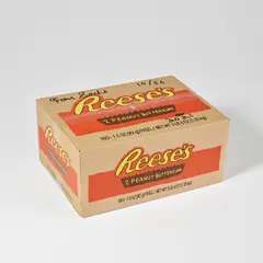 Tom Sachs, Reese's box, 2021, Multiple comprising sealed cardboard box with screenprint in colours on all sides, and Hershey chocolate confectionary contained in plastic wrappers designed by the artist