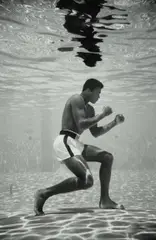Ali Underwater by Flip Schulke, 1961, Gelatin silver print, mounted, printed later, sold May 2024