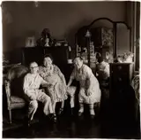 Russian Midget Friends in a Living Room on 100th St, NYC by Diane Arbus, 1963, Gelatin silver print, printed later by Neil Selkirk, sold May 2024