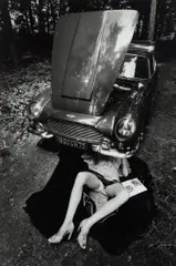 Jeanloup Sieff, Alone Under a Car with Open Hood, Paris, 1975, Gelatin silver print, printed later