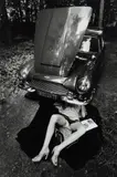 Jeanloup Sieff, Alone Under a Car with Open Hood, Paris