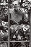Rosalyne Behind Fence, Arcangues, France by Helmut Newton, 1975, Gelatin silver print, printed early 1990s, sold May 2024