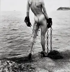Helmut Newton, Nude in Black Gloves with Metal Leg Support by the Sea, Monte-Carlo, 1994, Gelatin silver print