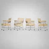 Warren McArthur, Armchairs, set of four, c. 1933, aluminum, upholstery, rubber