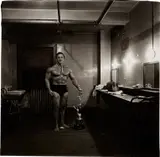 Diane Arbus, Muscle man in his dressing room with trophy, N.Y.C.