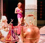 William Klein, Pink Maillot + Kettle + Guembri Musician in Courtyard, Morocco, 1958, Dye transfer print, printed later