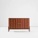 Cabinet, model no. MS. 120. by Ettore Sottsass, 1958-1963, East Indian rosewood-veneered wood, painted wood, East Indian rosewood, bronze, sold May 2024
